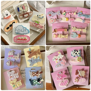 Cute cartoon animal hair clips set featuring puppies and cats on a display card