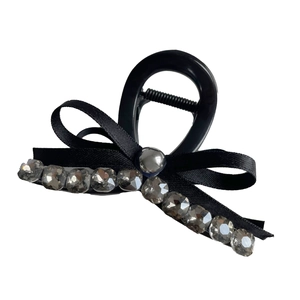 Elegant black satin bow hair claw clip with grey rhinestones and pearl detail