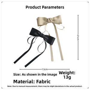 Vue détaillée de la taille des barrettes à cheveux en satin avec de longs rubans fluides