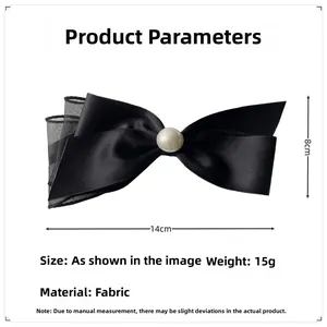 Detail showing 14cm x 8cm dimensions of a black satin bow hair clip with pearl