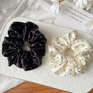 French vintage satin polka dot scrunchies set on elegant tray with floral decor