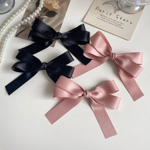 Elegant set of black and pink satin bow hair clips with a vintage French aesthetic