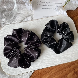 French style black satin polka dot scrunchies on decorative tray with white flowers