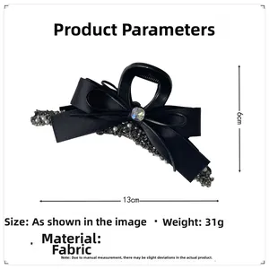 Detail view of 13cm black bow hair claw clip with pearls and rhinestones specifications