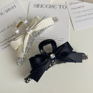 Elegant bow hair claw clips with rhinestones and faux pearls in black and white