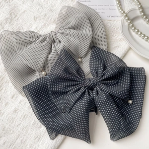 Vintage polka dot bow hair clips with pearls and chiffon layers in grey tones