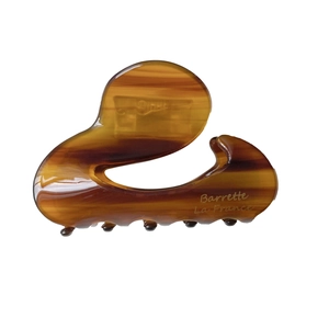 Brown tortoiseshell acetate hair claw clip with Barrette La France logo on white background