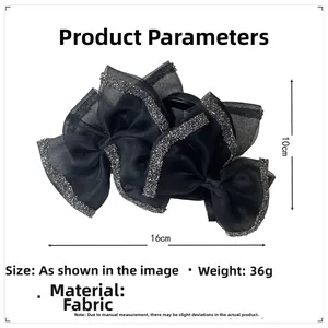Detail view of black bow hair claw clip with rhinestones and 16cm size measurement