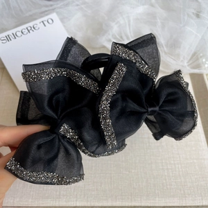 Elegant black mesh bow hair claw clip with silver rhinestones for a sophisticated look