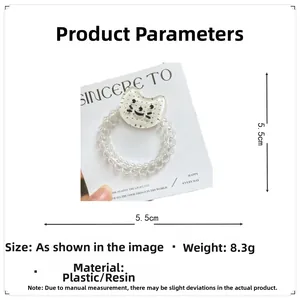Détail d'un élastique spirale transparent avec motif chat, diamètre 5,5cm et poids 8,3g