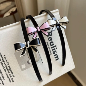Dreiteiliges Set eleganter Schleifen-Haarreifen in Rosa, Schwarz und Weiß mit Rand