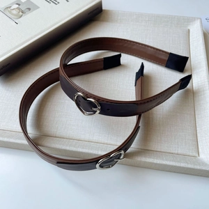 Dual-tone brown leather headband with heart buckle and vintage belt design