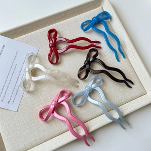 Elegant ballet style bow hair pins in six vibrant colors including red and blue