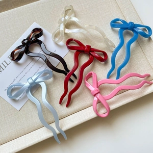 Elegant wavy bow hair sticks in six colors including pearlescent white and classic black