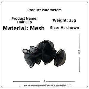 Détail de la pince à cheveux noeud en organza noir montrant taille 13cm et poids 25g