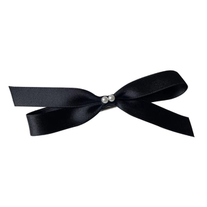 Elegant black satin bow hair clip with white pearls featuring a minimalist design
