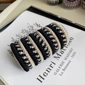 Detailed close-up of high elasticity knitted hair ties with textured woven surface