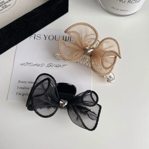 Barrettes à cheveux avec nœud en résille et strass cœur en noir et champagne