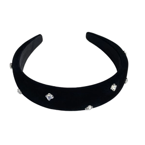Elegant black velvet padded headband with sparkling star rhinestones on white background