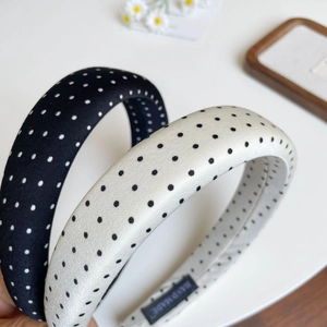 Chic padded sponge headbands in black and white polka dots with smooth satin finish