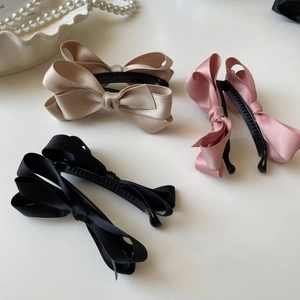 Set di eleganti fermagli per capelli in raso con fiocco nei colori champagne, rosa e nero