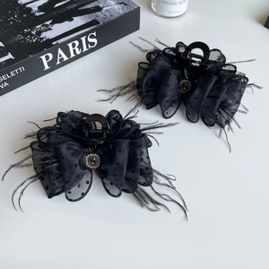 Elegant black feather and mesh polka dot shark hair clip with crystal rhinestone embellishment