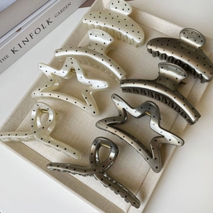 French style polka dot hair claws in cream and grey colors with star and ribbon shapes