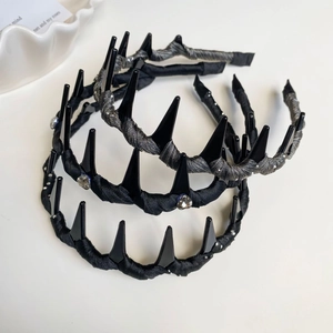 Detail of Korean resin headbands with black punk spikes and crystal rhinestone accents