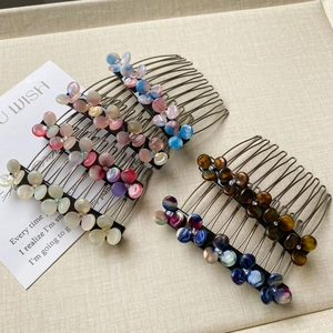 Elegant floral hair side comb with pearl luster petals and sparkling rhinestones