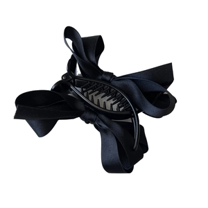 Elegante pinza per capelli con fiocco in raso nero per acconciature da donna