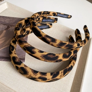 Three-piece set of wide leopard print fabric headbands with handmade labels for women