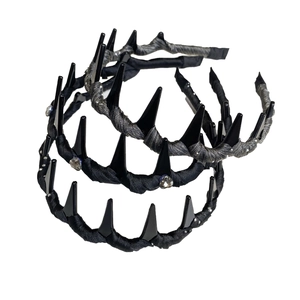 Gothic style spiked headbands with rhinestones and black punk studs on white background