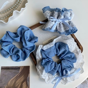 Three-piece denim and lace scrunchie set with ribbon bows and small pearl charms