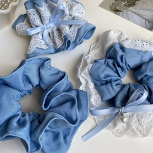 Blue tencel denim scrunchies with white lace embroidery, bows and pearl charms