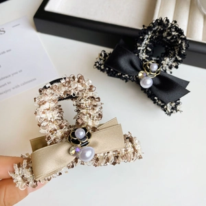 Classic tweed hair claws with satin bows, faux pearls and camellia flower decorations