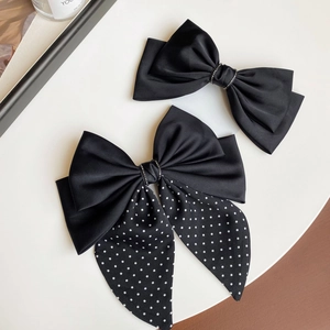 Elegant French black satin bow hair clips with polka dots and sparkling rhinestones