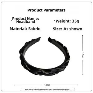 Detailed view of the 13cm black braided headband with sparkling rhinestone accents