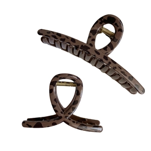 Set of two leopard print hair claws with strong gold springs for thick hair styling