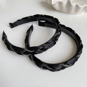 Braided black satin headband with sparkling rhinestones for elegant hair styling