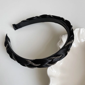 Detail of braided headband with rhinestones showing non-slip teeth and satin fabric