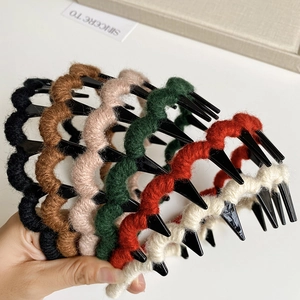 Detail showing non-slip wavy headbands wrapped in multi-colored wool yarn set