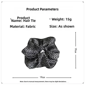 Detail view of large 19cm floral hair scrunchie with 15g weight and soft fabric texture