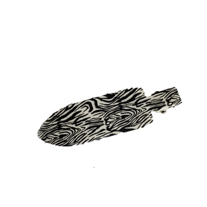Zebra pattern hair clip with black and white streaks on a metal duckbill hair accessory