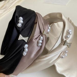 Elegant French satin pearl headbands with rhinestone bow accents in multiple colors