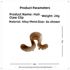 Detail view of small amber metal hair claw clip with 6cm measurement and sturdy spring