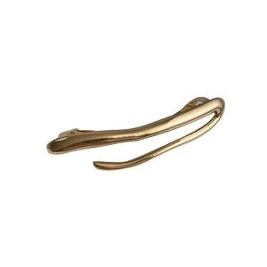 Minimalist gold irregular liquid metal hair clip with a sleek polished branch design