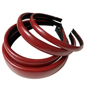 Three premium red faux leather padded headbands with a high-shine glossy finish for women