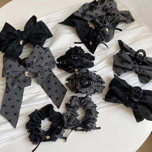 Elegant grey hair accessories set with lace scrunchies, bow clips and hair claws on silk