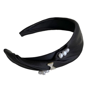 Elegant black satin headband featuring white pearls and rhinestone butterfly decoration
