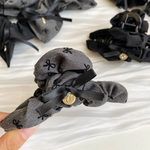 Elegant grey hair claw clip with embroidered bow and gold metal detail for women